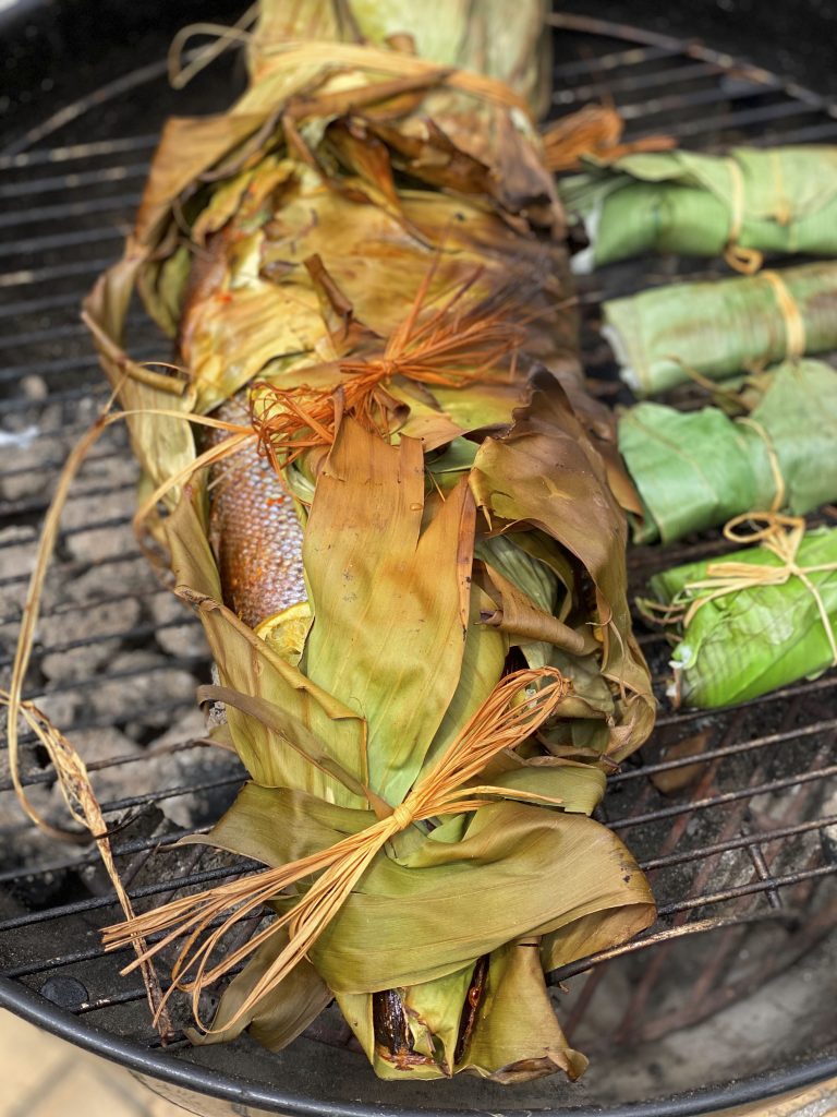 Trout cooked in banana leaves