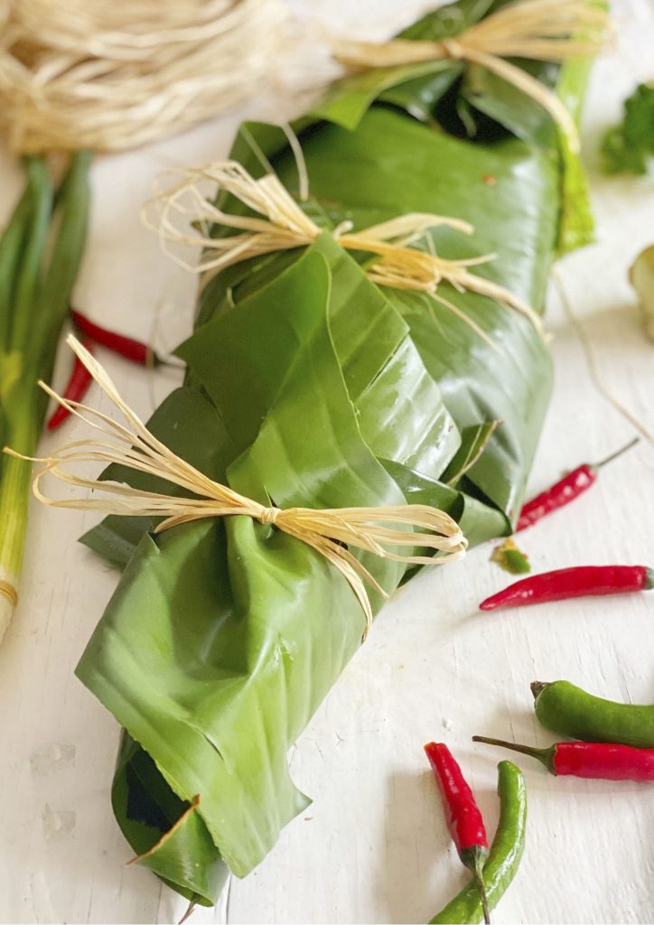Trout cooked in banana leaves